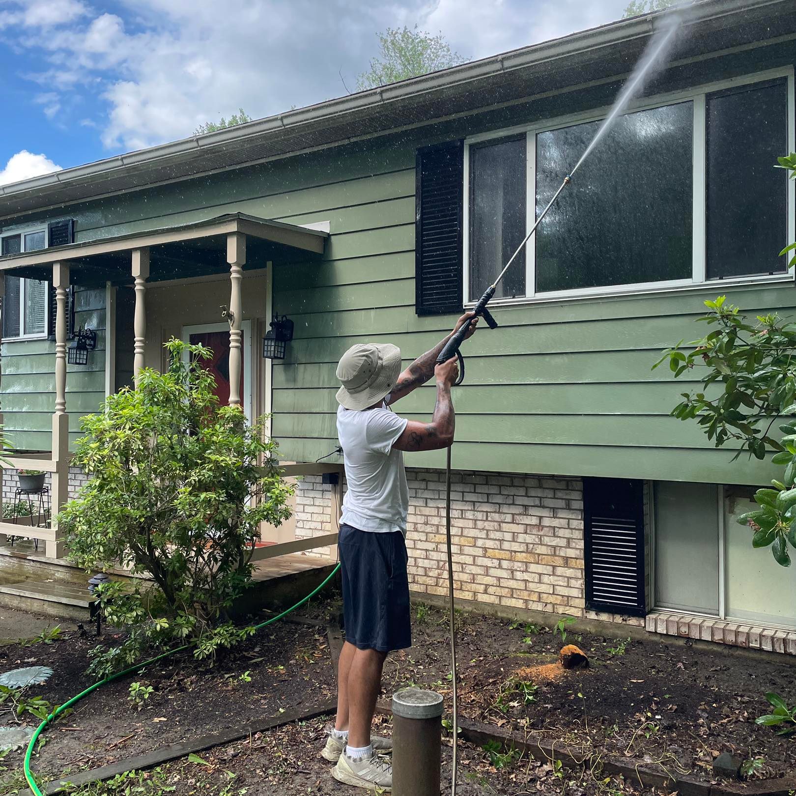 Pressure washing house